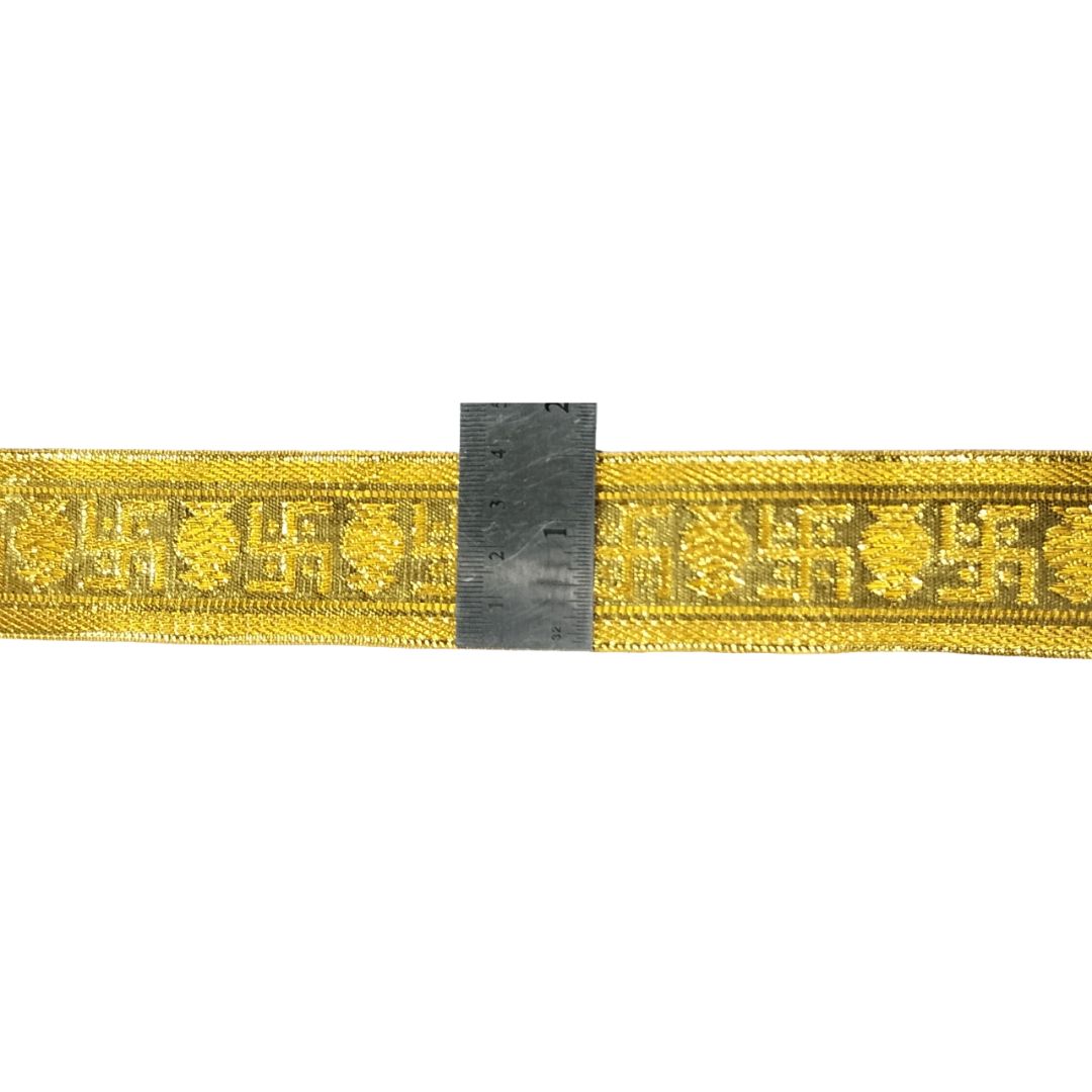 Yellow webbing strap with a ruler for scale on a white background